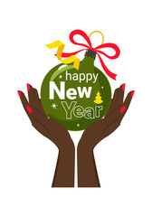 A Christmas ball in a woman's hand. Happy New Year.