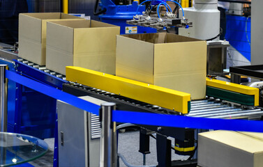 Cardboard boxes on conveyor belt. parcels transportation system concept	