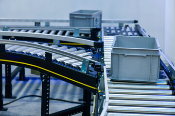 Plastic box on conveyor belt.parcels transportation system concept