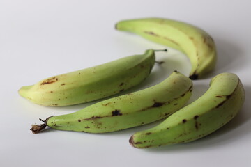 Raw plantains with dark specks, used for banana chips in South Indian cuisine