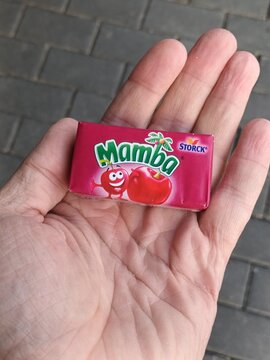 Hand Holding a Mamba Cherry Candy Package