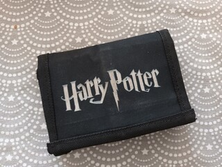 Naklejka premium Harry Potter Logo on a Black Wallet