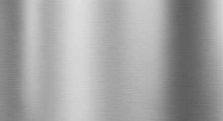 A close-up photograph showing a brushed metallic surface, exhibiting vertical light reflections, creating a gradient effect of light and shadow