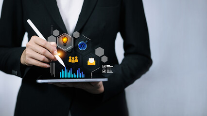 Businessman using digital tablet with business icons, innovation and data analysis concept