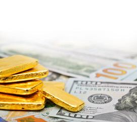Paper us 100 dollar bill with gold bars, concept of investment and saving wealth, copy space	
