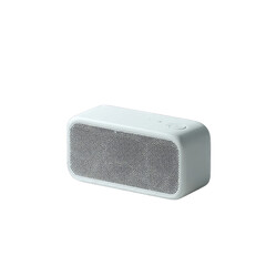 Minimalist Light Blue Portable Bluetooth Speaker with Perforated Grille.