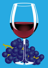 Glass of red wine with a bunch of grapes