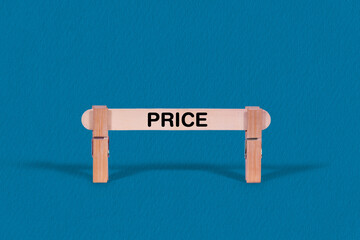Price symbol. Single Wooden stick confined by  Clothespins, Cool Blue Background. Business and Price concept with copy space