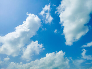 Bright Blue Sky with Fluffy White Clouds