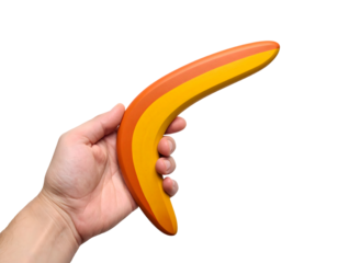 A person's hand holds a vibrant, multi-colored wooden boomerang, ready for outdoor play and fun.