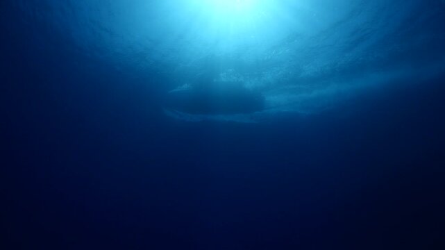 boat moves away underwater  shot