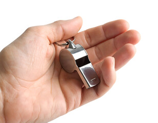A human hand carefully holds a shiny silver-colored whistle, symbolizing communication and authority.
