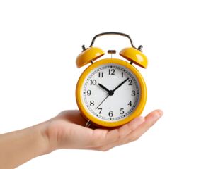 A human hand presents a bright yellow alarm clock, representing the concept of time and deadlines.
