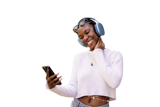 Joyful Woman Enjoying Music on Her Smartphone with Headphones Outdoors
