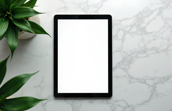 Serene workspace with white marble countertop. Blank white tablet on left side with green plants on right side. Balanced composition creates harmonious and tranquil atmosphere for work or home use. - Powered by Adobe