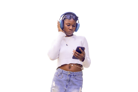 Young Woman Enjoying Music on Her Phone with Headphones