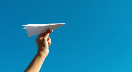 woman hand holding a paper plane