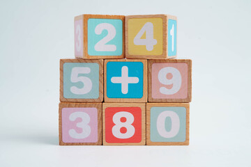 Number wood block cubes for learning Mathematic, education math concept.