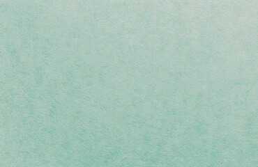 Pale blue wallpaper with a wet plaster texture for home or office decor