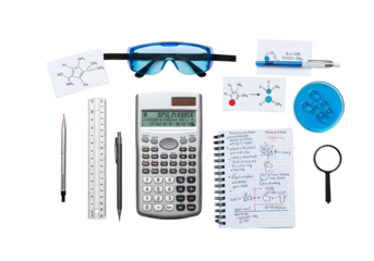 Flat lay of essential academic and office supplies calculator, ruler, pencils, grid notebook, and safety glasses on white, for study, precision, and safety