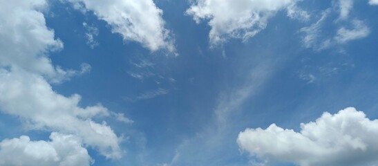 Obraz premium Blue Sky with White Clouds Background