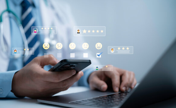 Doctor using smartphone and laptop with digital patient feedback icons and rating star, representing online healthcare review, hospital service quality, satisfaction survey and telemedicine experience