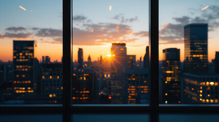 A city skyline with a sun setting in the background