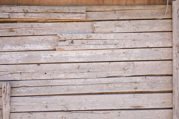 Weathered wooden planks with peeling paint