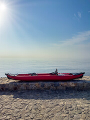 Fototapeta premium Kayak on vertical shore with space for text