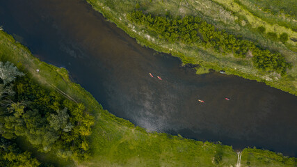 Aerial View of a Winding River with Kayaks in Nowy Lubiel, Poland