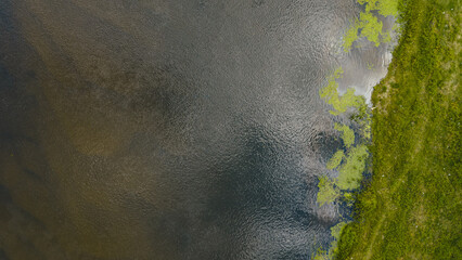 Aerial View of River and Grassy Bank in Nowy Lubiel, Poland