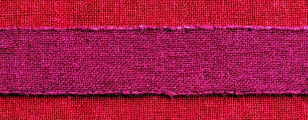 Close-up view of a horizontal band of deep pink fabric against a deep red fabric.
