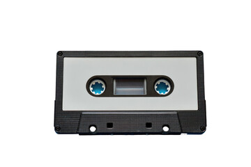 Obraz premium A vintage cassette tape, black and white, on a black background