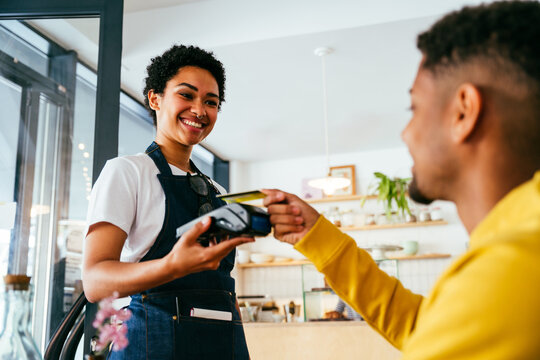 Barista working in a bar cafeteria