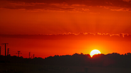 Sunset in Roz-sur-Couesnon, Normandy, France – evening sky over the village and surrounding landscape.