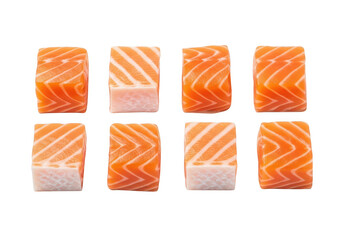 Eight perfectly cut raw salmon cubes arranged on background fish food