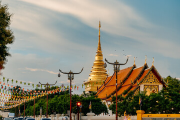 A beautiful shot of Wat Chang Kham temple in Nan, Thailand, featuring its stunning golden stupa.