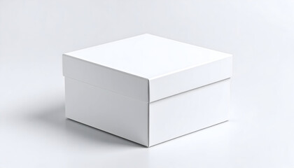Fototapeta premium A closed white square gift box with a lid, presented as a mockup template on a clean, neutral white background.