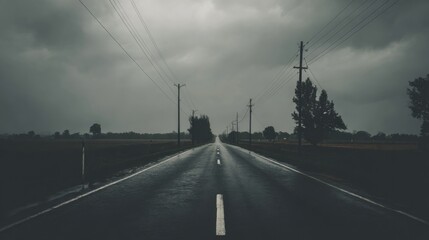 Moody overcast sky over an expansive empty roadway with atmospheric depth.