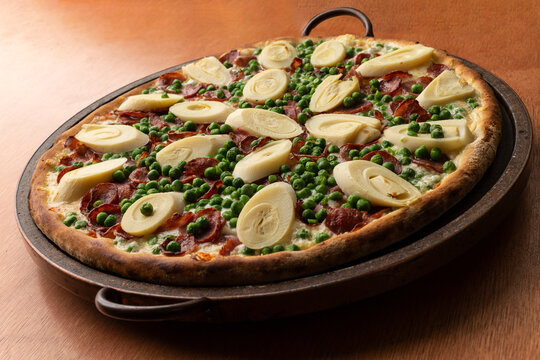 Pizza de palmito com bacon e ervilha