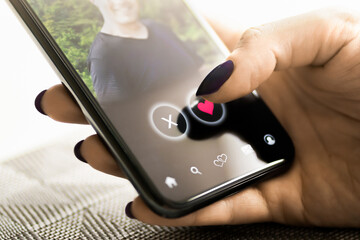 Date app. Woman and love. Online romance scam. Cheating, swiping right or stalker. Profile picture of a man. Virtual relationship. Finger and heart.