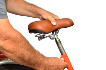 Manually adjusting the height of the bicycle seat.