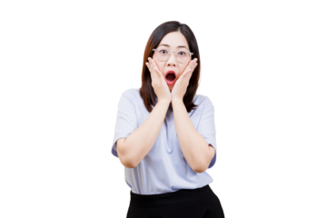 A surprised Asian young beautiful woman with glasses expresses shock, holding her face in astonishment.