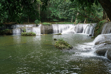 Obraz premium Chet Sao Noi Waterfall National Park or Seven Little Girls waterfall, a seven tiers of small and beautiful waterfall in Namtok Chet Sao Noi National Park, Saraburi, Thailand.