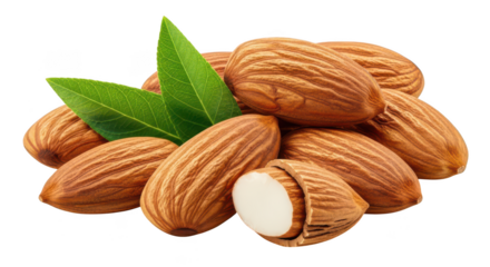Pile of whole almonds with green leaves and one split almond nut nuts food