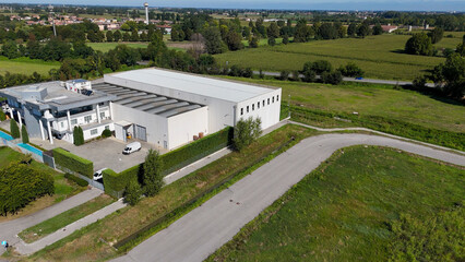 Modern White Industrial Building with Solar Panels in the Italian Countryside Near Milan Lombardy Providing Data Center and Cloud Storage Solutions