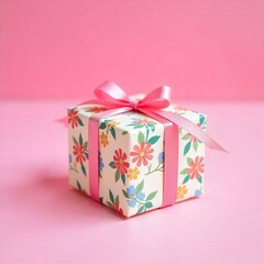 Elegant gift box with red ribbon on plain background.