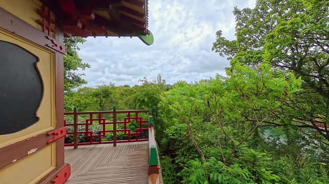 High up view through the trees and over the water from a wooden outbuilding