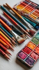 Obraz premium Assorted art supplies on a light surface