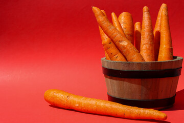 Bunch of carrots in a wooden basket.